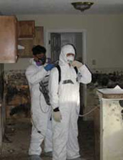 Workers wearing protective masks Gentilly house in New Orleans